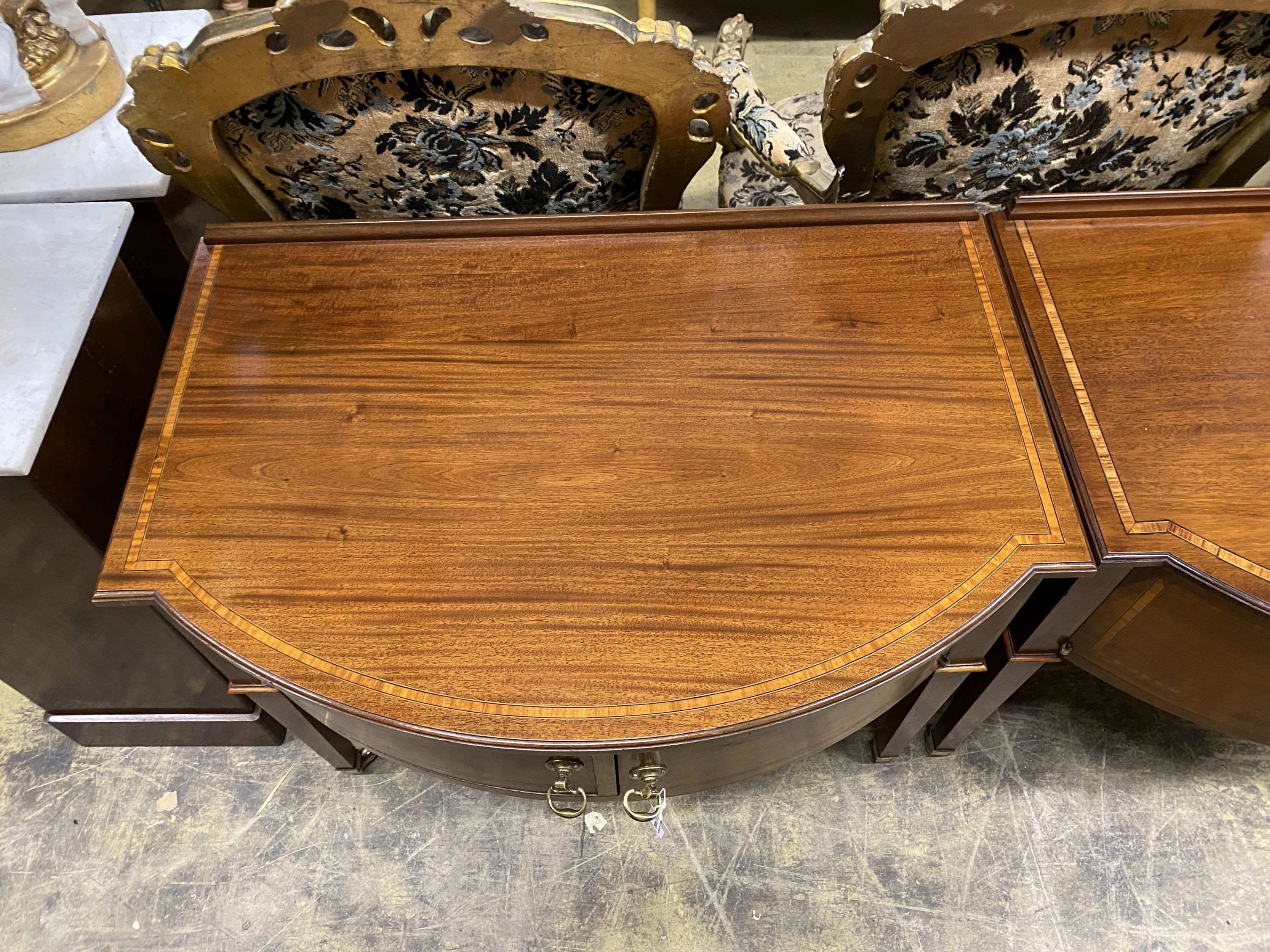 A pair of Edwardian satinwood banded mahogany bow front side cabinets, width 90cm, depth 60cm, height 78cm